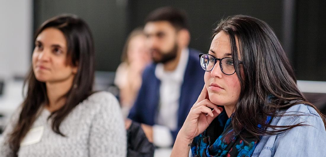 MBA students listening to speakers at Orientation.