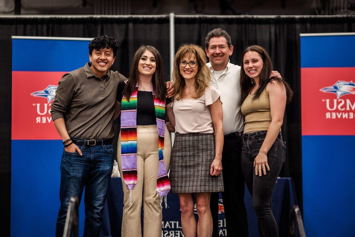 A student with with their family during LatinX graduation